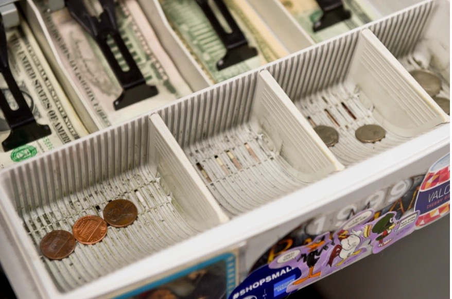 The cash register change drawer at Symbiote Collectibles in West Reading