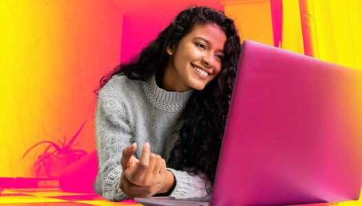 A woman studies on her laptop for the PayMyTuition Case Study