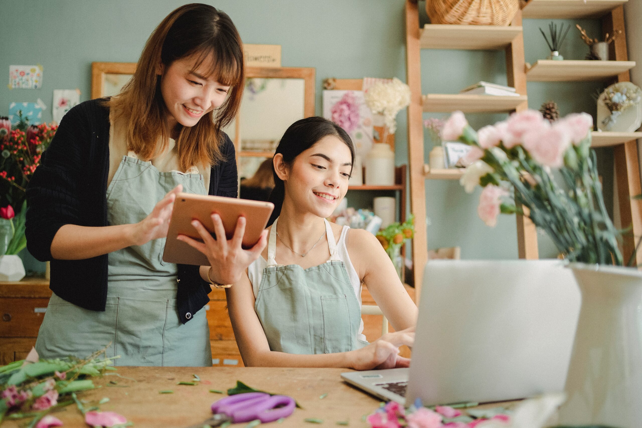 Small business owners holding ipad