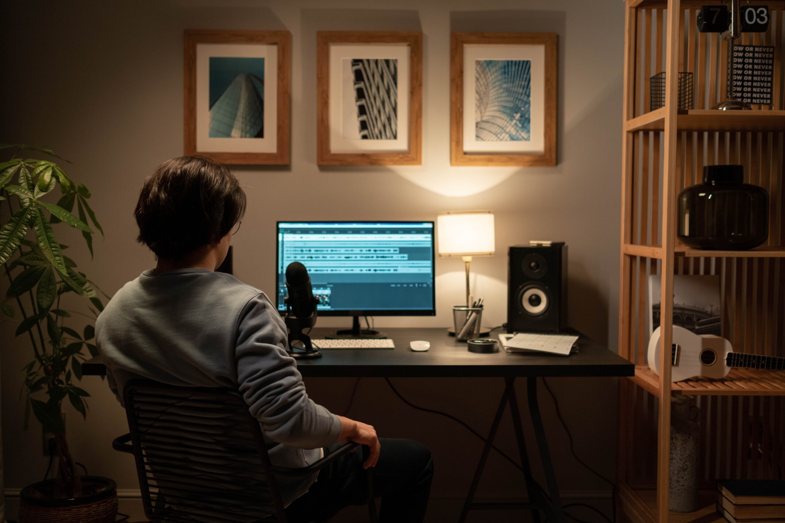 Developer looking at computer screen in dark room