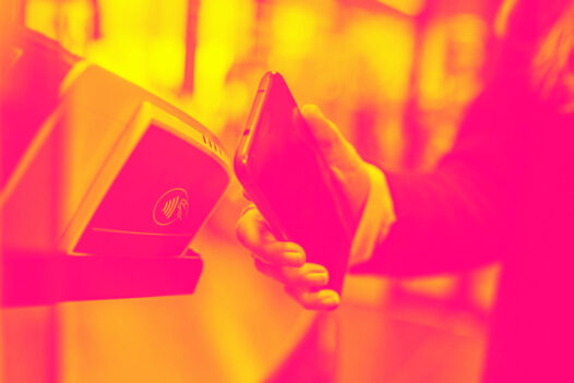 A man pays with his mobile device at a payment terminal